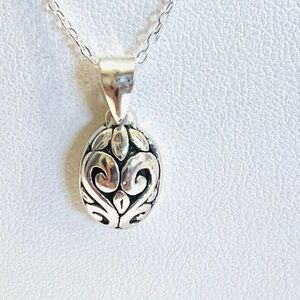 925 sterling silver filigree pendant necklace featuring a scroll &swirl design.